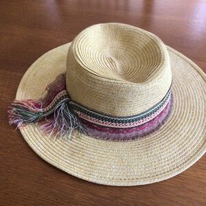 Woven sun hat/summer hat with tie embellishment.  Adjustable interior headband.